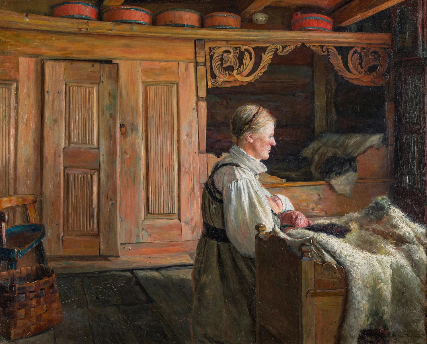 Interno con donna che allatta al seno